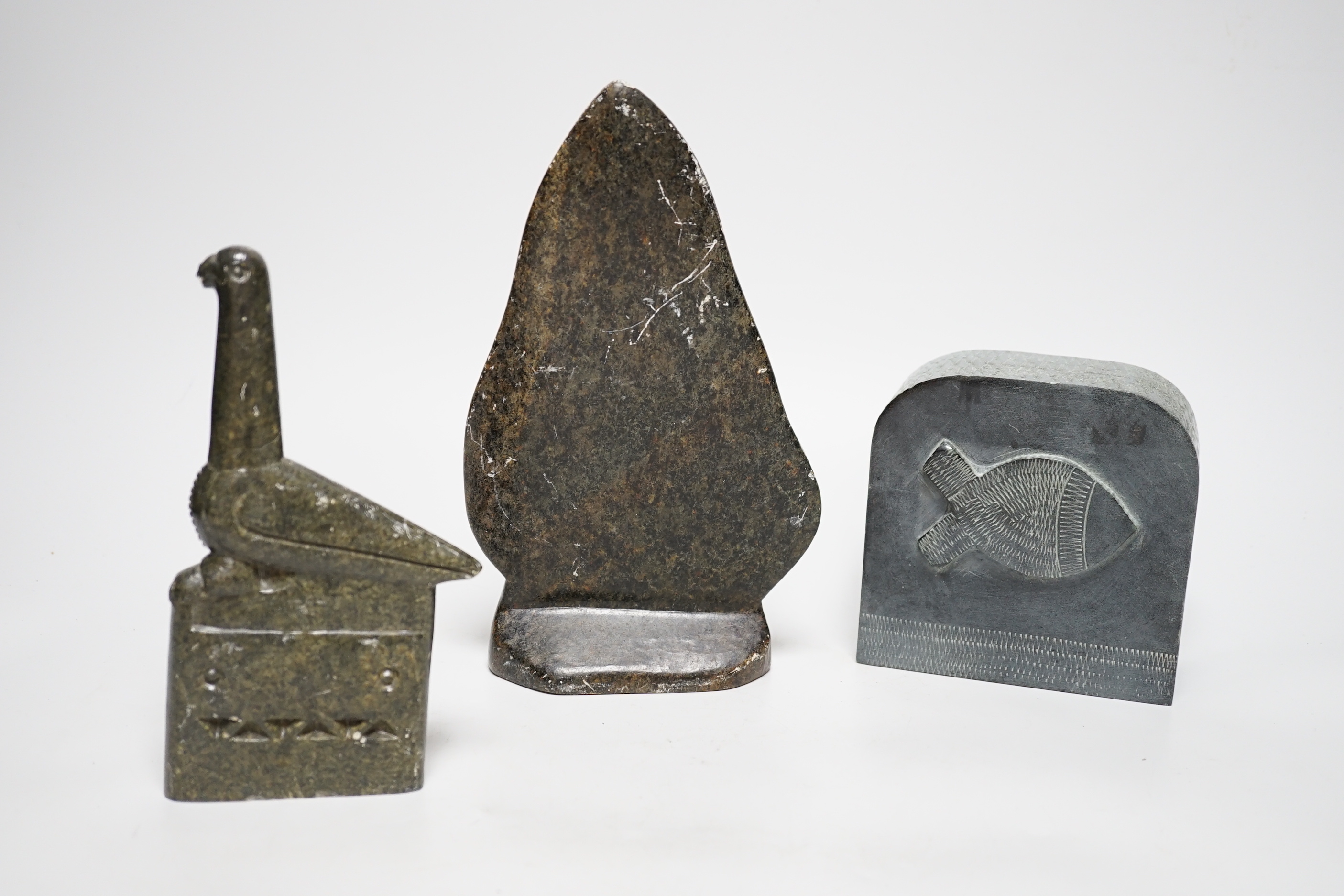 Three Eskimo Inuit soapstone carvings including a bird and fish, the largest 23cm high
